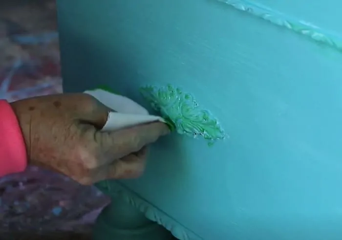 green color wash on turquoise paint