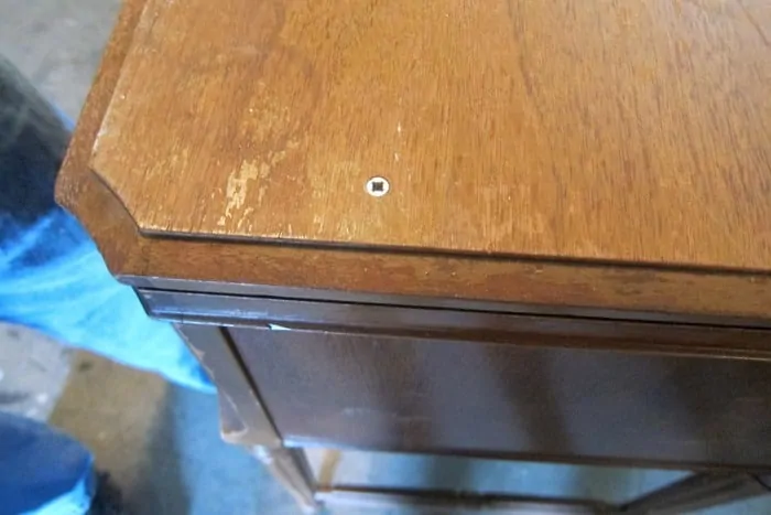 screw the top down on an old sewing machine cabinet