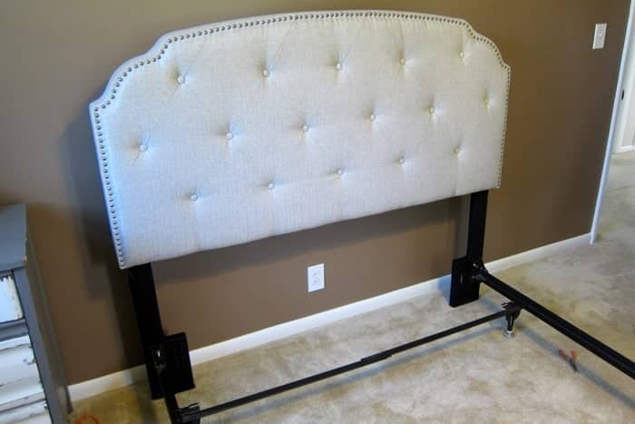 new upholstered headboard attached to bed frame