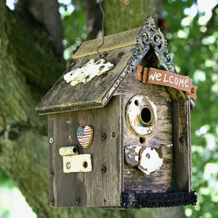 100 cheap diy home decorating projects, Update An Old Birdhouse With Vintage Hardware And Bits Of Jewelry