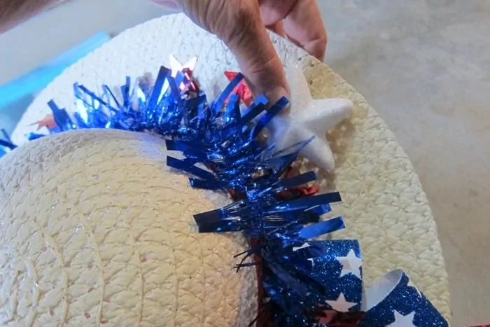adding stars to a red white and blue hat wreath