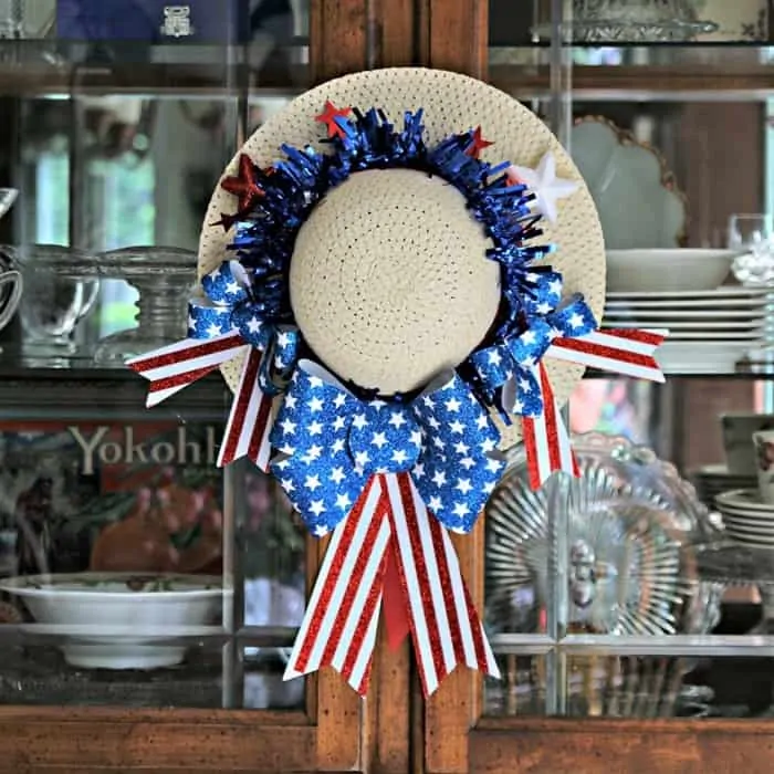 hang a DIY wreath on a China cabinet