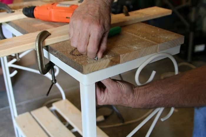 screwing wood planks to metal