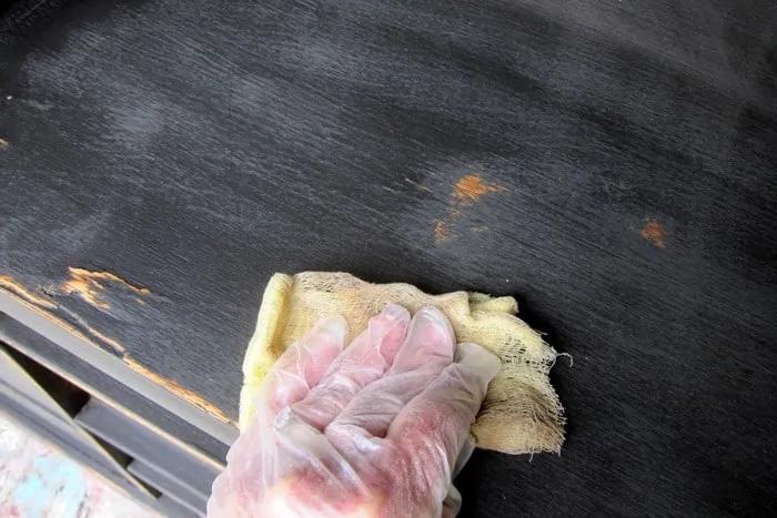 use a tack cloth to remove sanding dust