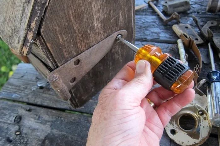 use screws to add hinges to a birdhouse