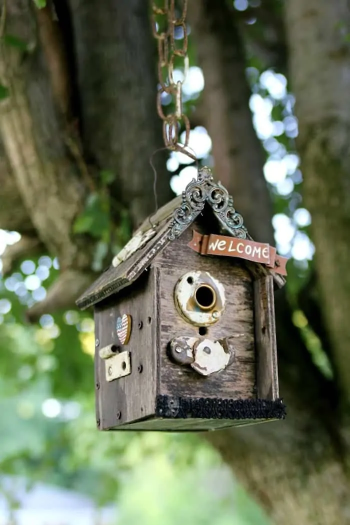 wood birdhouse makeover with door hardware and salvaged jewelry