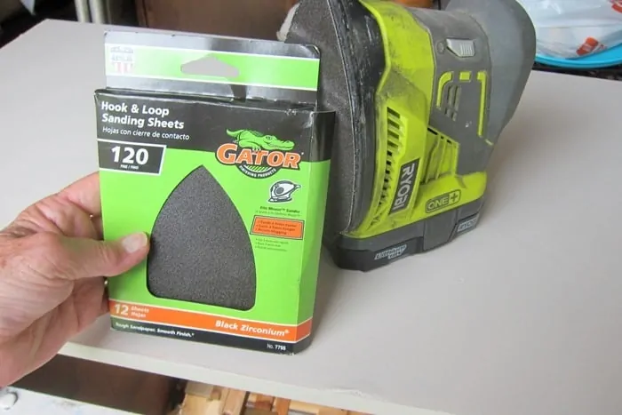 Sandpaper and an battery powered sander for distressing furniture 