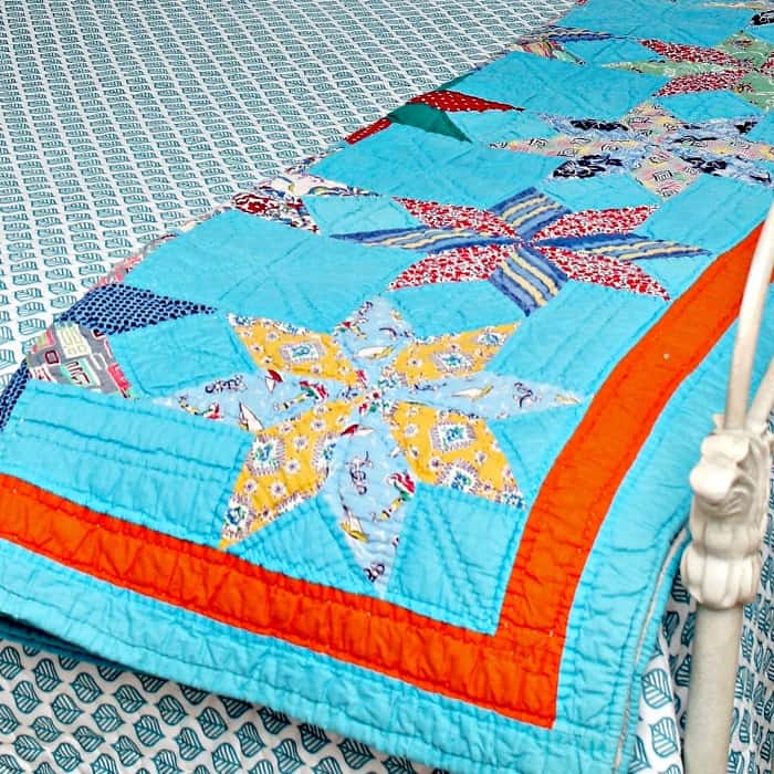 beautiful handmade quilt with turquoise and orange design