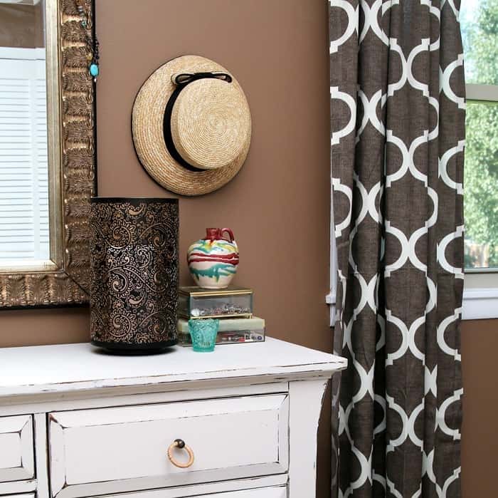 hang straw hats as wall decor