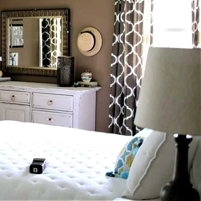 brown bedroom with hat decor