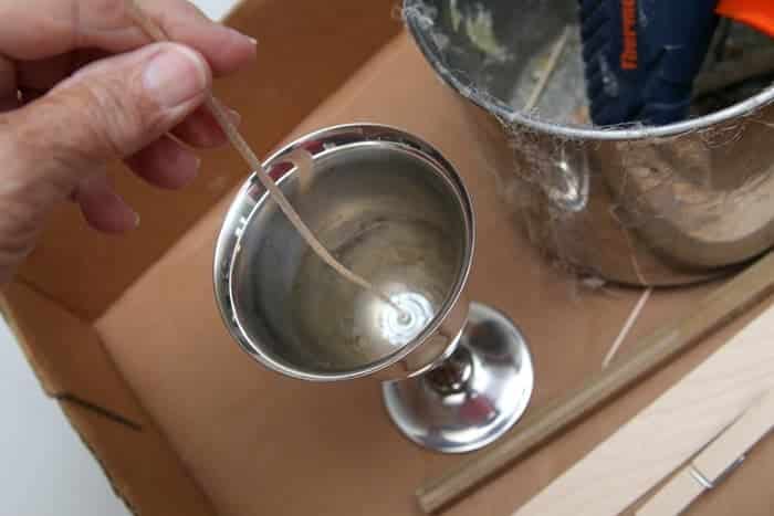 glue wick to bottom of candleholder