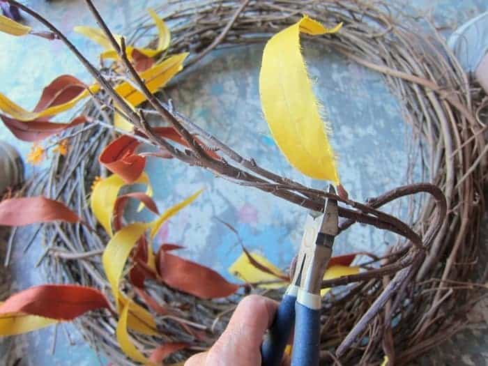 trim flower stems for wreath.