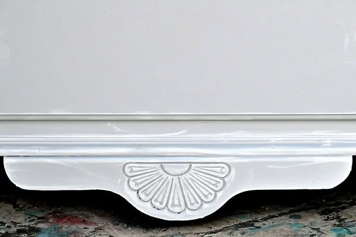 painted furniture detail highlighted with white paint