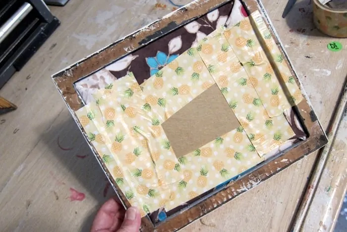 use duck tape to hold picture in frames