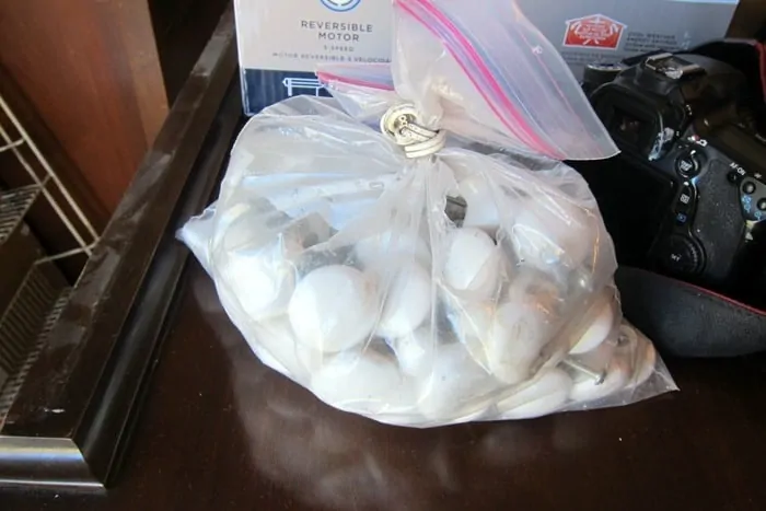 bag lot of glossy white cabinet or furniture knobs