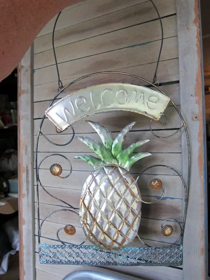 pineapple welcome signs bought at a yard sale