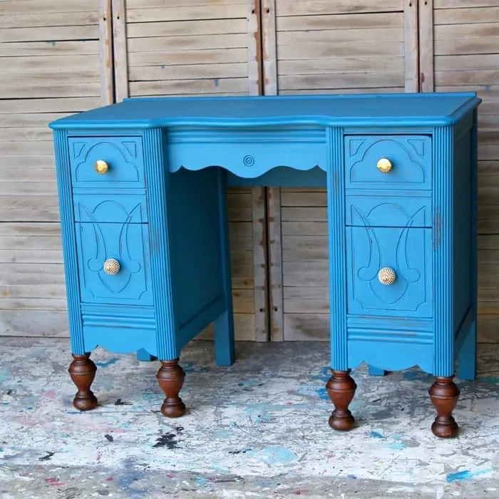 blue furniture vanity with gold knobs