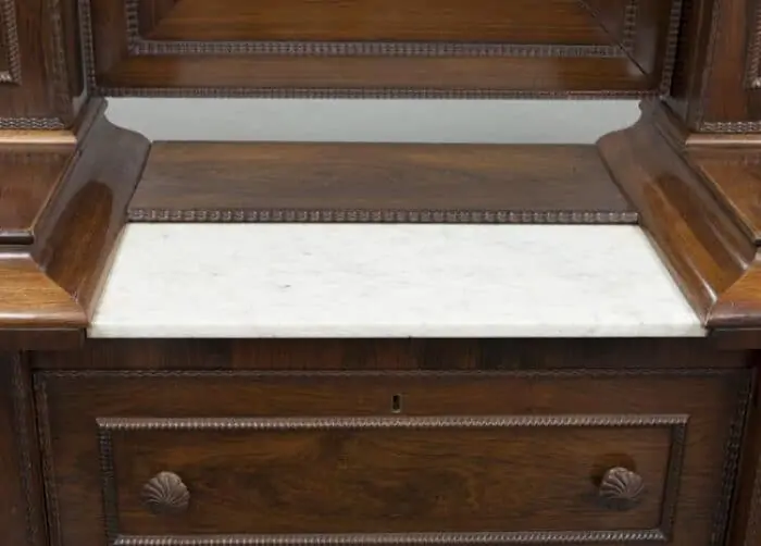 marble top on an antique wig dresser