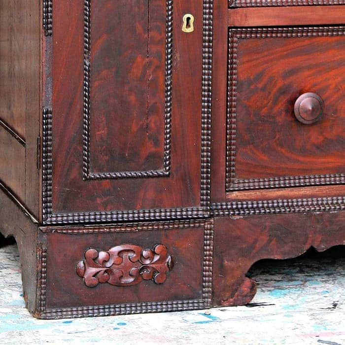 ornate details on antique wood dresser