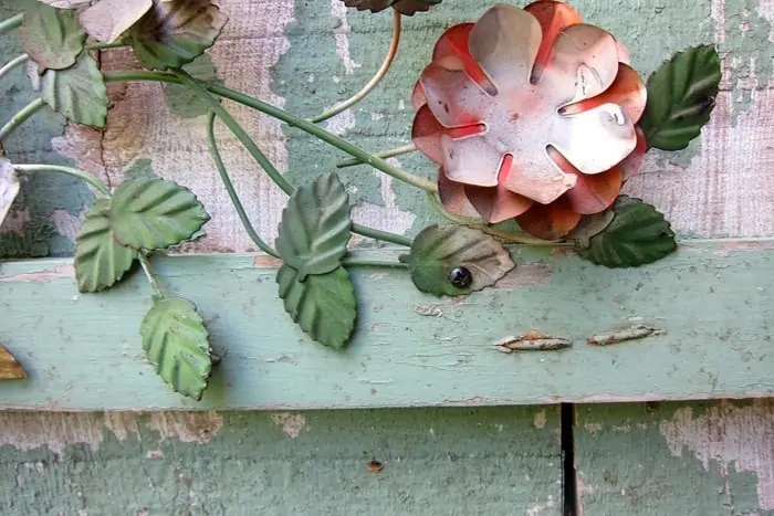 drill holes in metal pieces to attach to wood wall decor