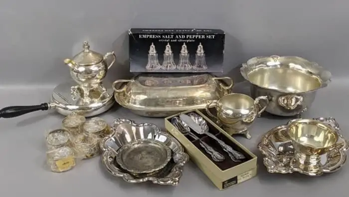 shiny silverplate dishes, trays, and salt and pepper shakers