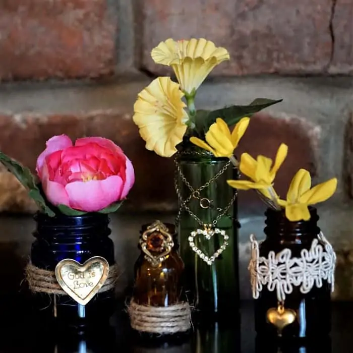Make decorative flower vases using small vintage bottles