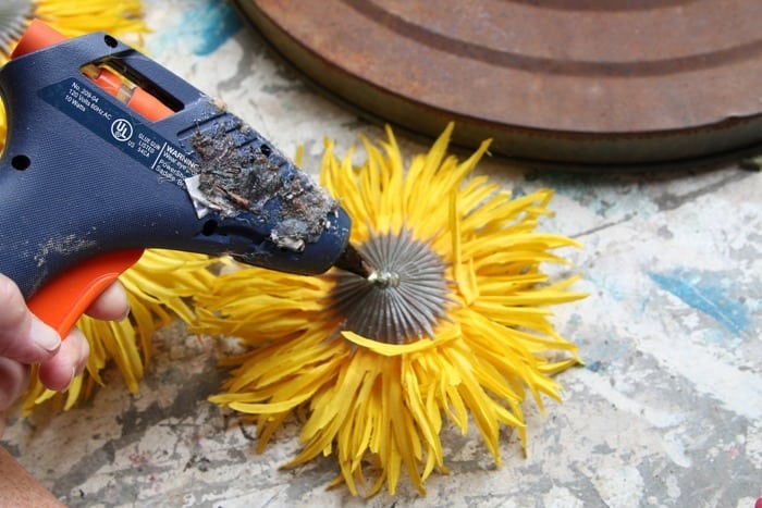 hot glue sunflowers to wreath form