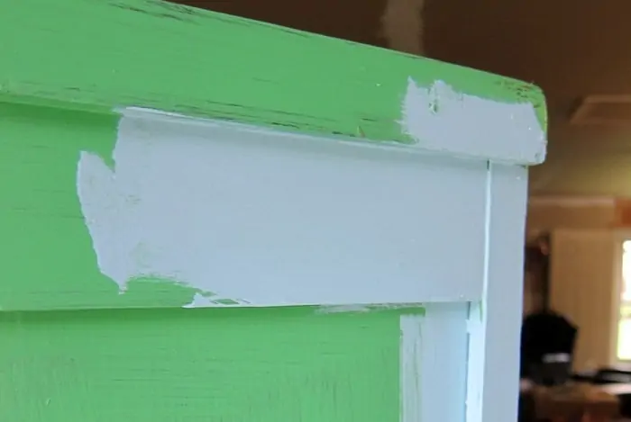 layering blue paint over green paint