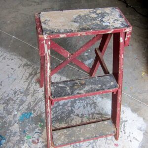old red step ladder found at the junk shop