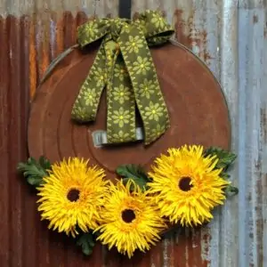 rusty trash can lid sunflower wreath thrift store decor project