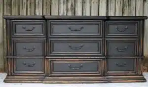 heavily distressed black furniture is a Pottery Barn knockoff