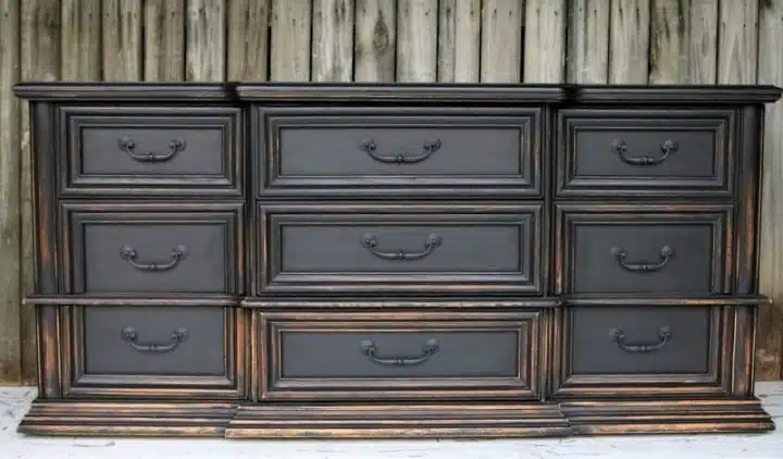 heavily distressed black furniture is a Pottery Barn knockoff