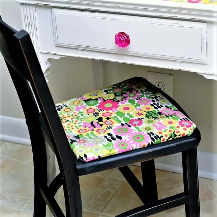 Desk painted white with black chair