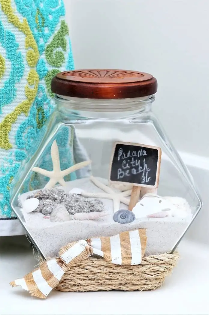vacation memory jar includes beach sand and seashells along with sisal rope glued to jar