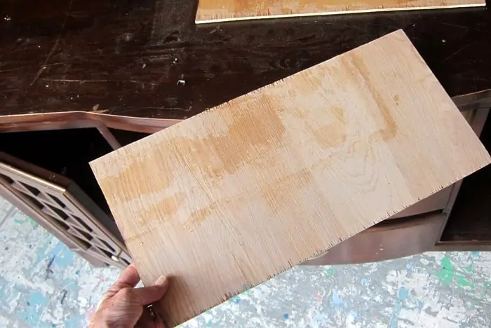 cut a piece of wood to repair furniture
