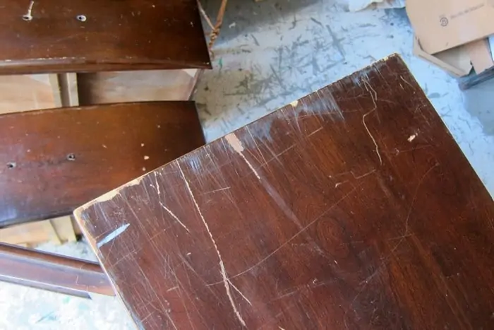 top of furniture with deep scratches in finish