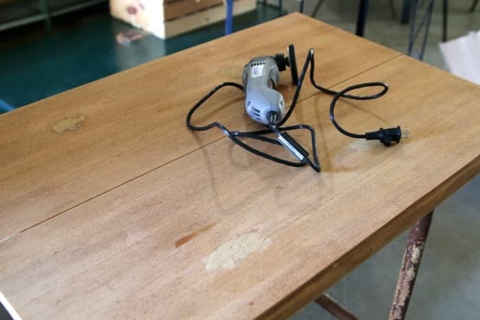 attaching a table top to an iron table base