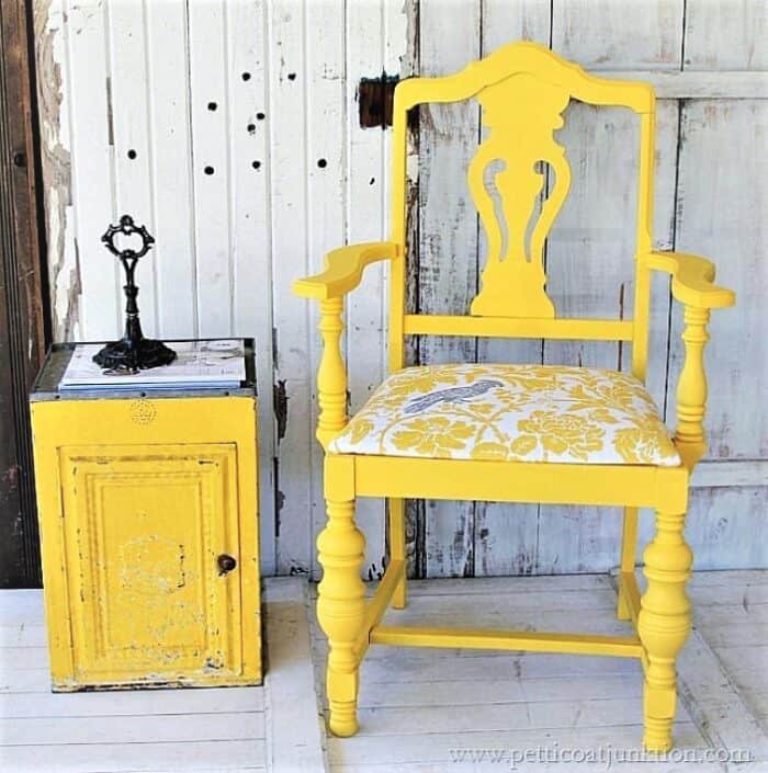 bold yellow painted chair with covered seat