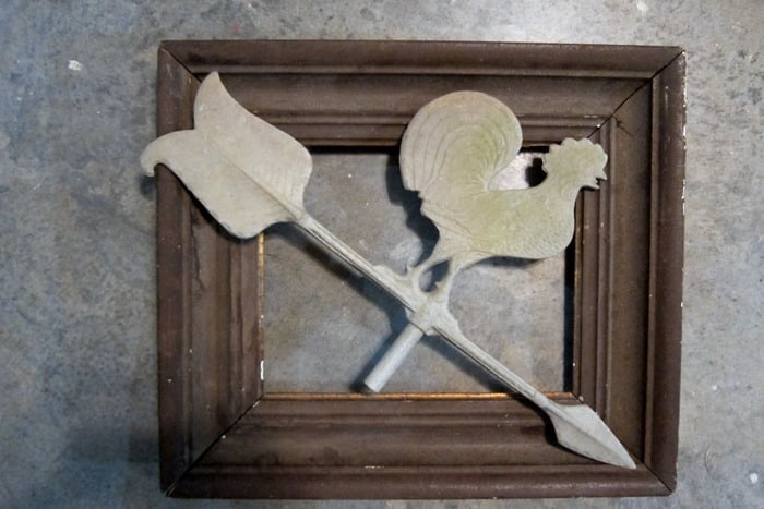old wood frame and decorative weather vane