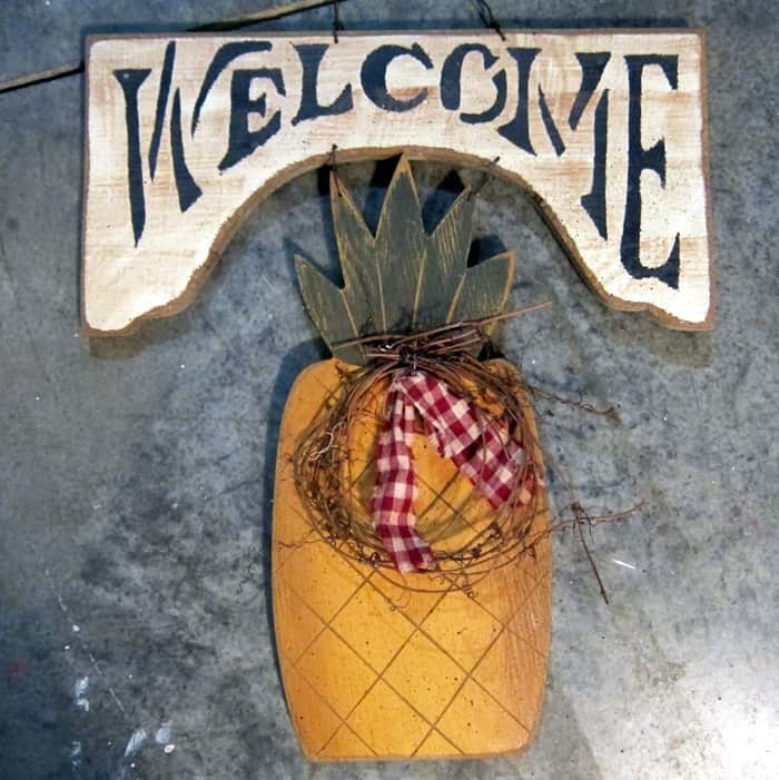 outdated pineapple welcome sign from thrift store
