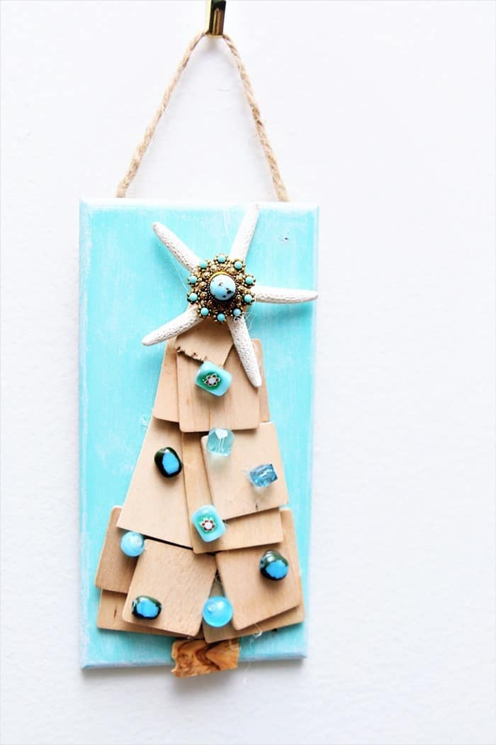 little Christmas tree wall hanging in turquoise made with unfinished wood and blue beads with a starfish topper (2)