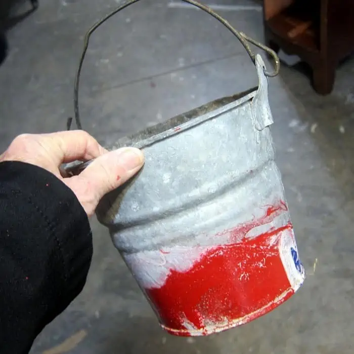 old galvanized bucket to paint with metallic copper spray paint for a flower pot