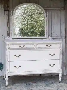 Paint an old dresser and distress the paint. Favorite painted furniture project of 2022