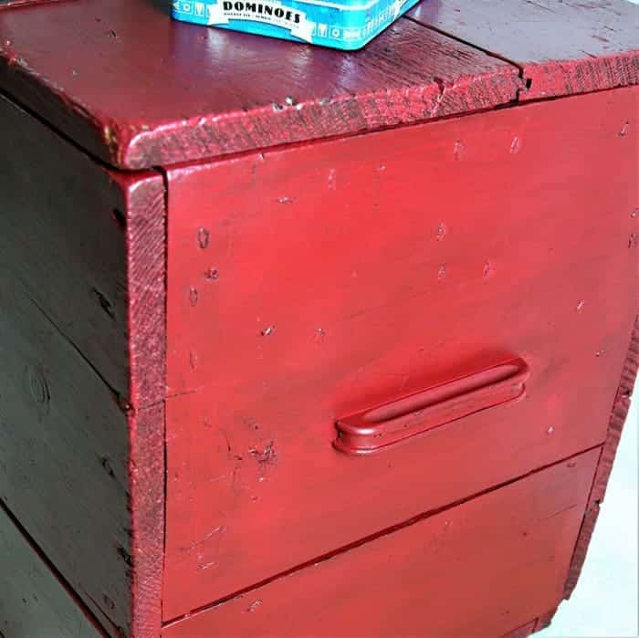 red blanket chest with wood handles