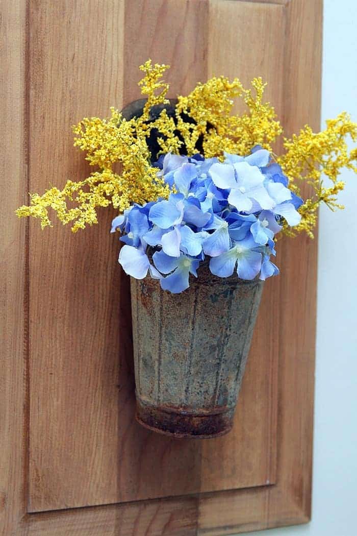flowers in a bucket wall hanging