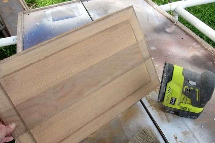 sand the finish on a recycled cabinet door