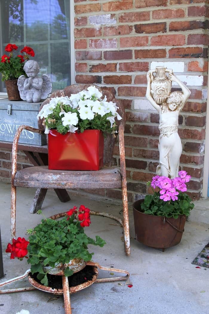 how to decorate the porch for Spring using rusty junk finds