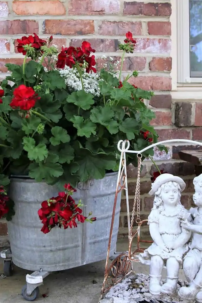 use an old mop bucket as a flower planter