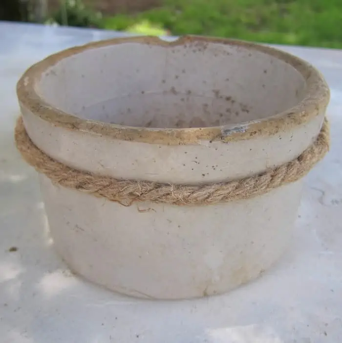 hot glue sisal rope to an old crock to make a succulent pot planter