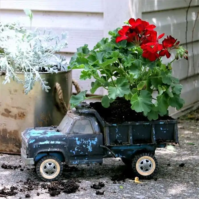 use unique items as flower planters like this blue kids metal truck